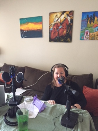Kym on the mic, ready to podcast!